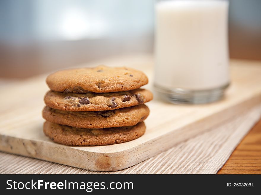 Cookies on plate with milk in background. Cookies on plate with milk in background