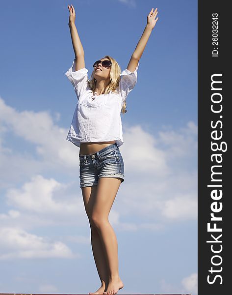 Beautiful Girl In Sunglasses On  Blue Sky