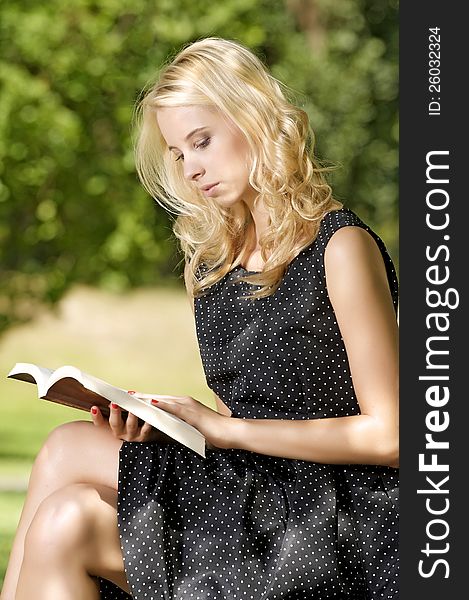 Young woman reading book