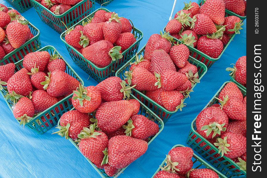 Organic strawberries on display at outdoor Farmers Market. Organic strawberries on display at outdoor Farmers Market