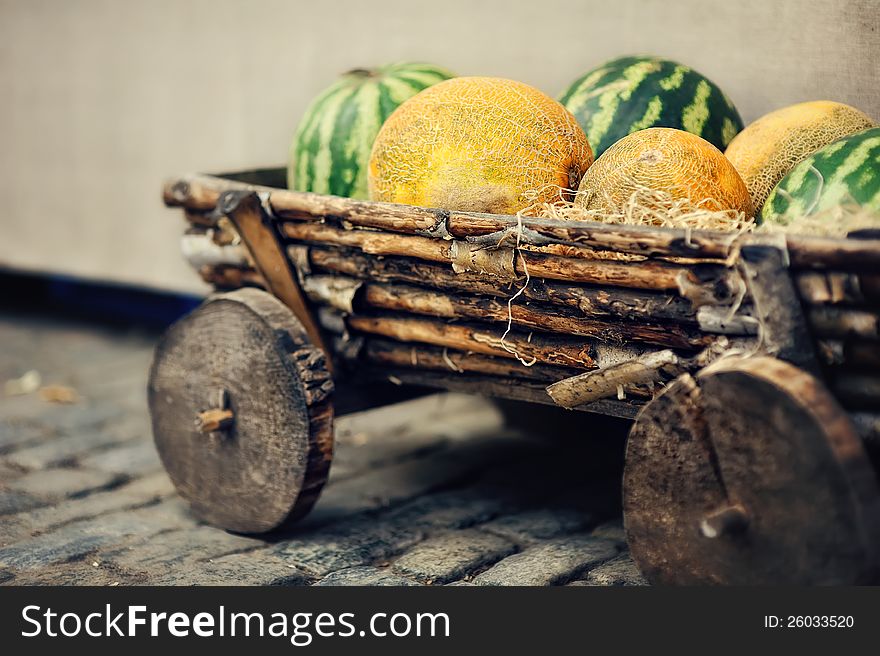 Derevanny cart with big ripe water-melons and melons. Derevanny cart with big ripe water-melons and melons