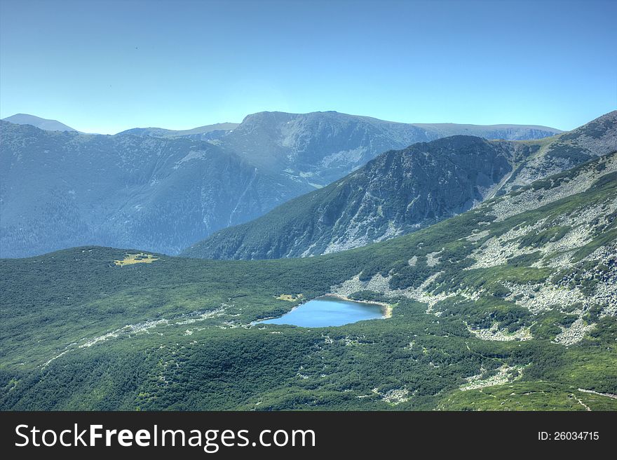 A beautiful high mountain landscape from Saragyol lake in Rila mountain in Bulgaria. A beautiful high mountain landscape from Saragyol lake in Rila mountain in Bulgaria