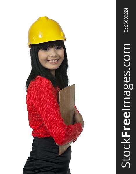 Architect woman holding clipboard isolated over white background. Architect woman holding clipboard isolated over white background