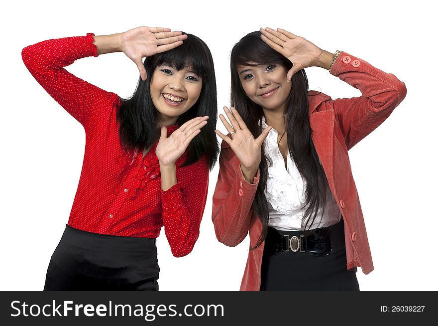 Two business women framing isolated over white background. Two business women framing isolated over white background