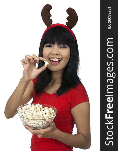 Santa woman eating popcorn isolated over white background. Santa woman eating popcorn isolated over white background