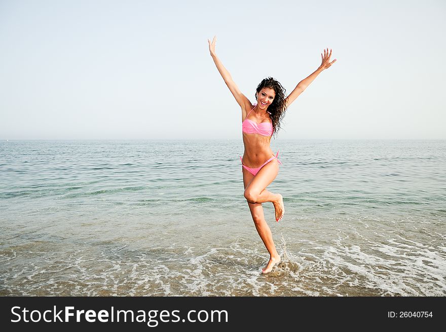 Woman with beautiful body on a tropical beach