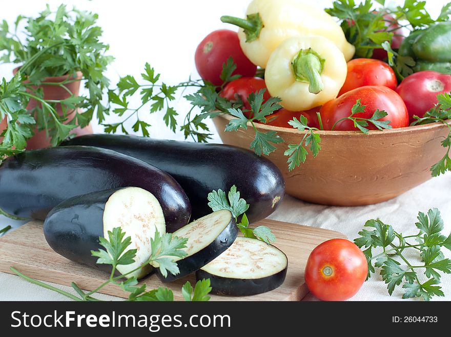 Fresh aubergines, whole and sliced