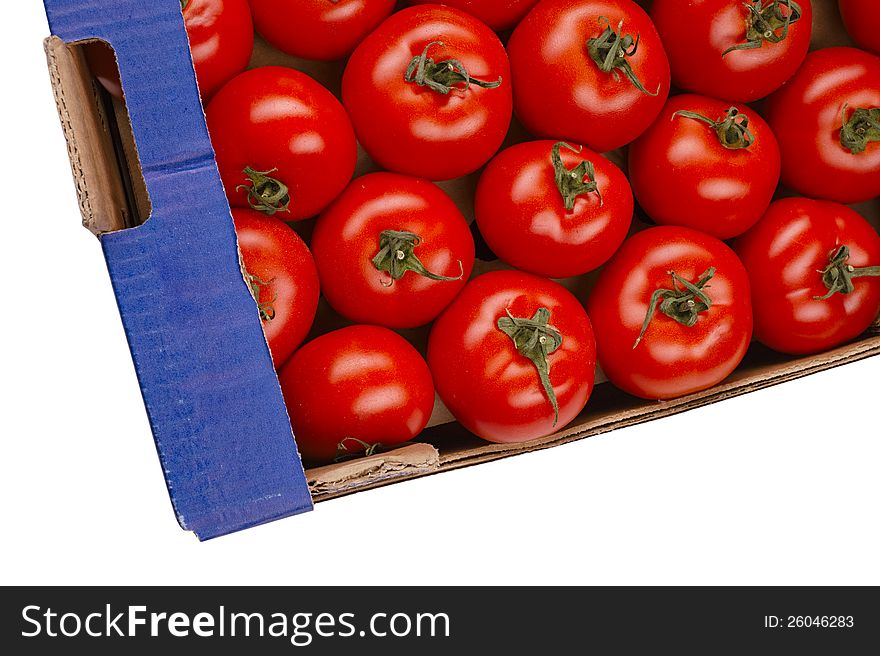 Tasty tomatoes in a box isolated on white. Tasty tomatoes in a box isolated on white