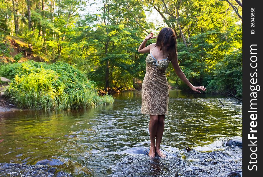 Beautiful girl with long hair in river. Beautiful girl with long hair in river