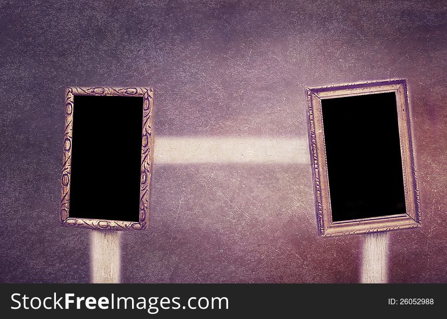 Two frames with black empty space hanging on a wooden chair. Clipping paths included. Two frames with black empty space hanging on a wooden chair. Clipping paths included.