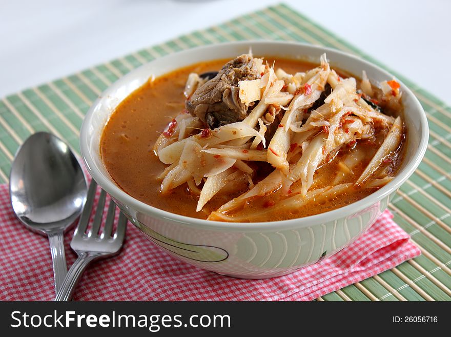 Curry Soft bamboo shoots with spoon fork