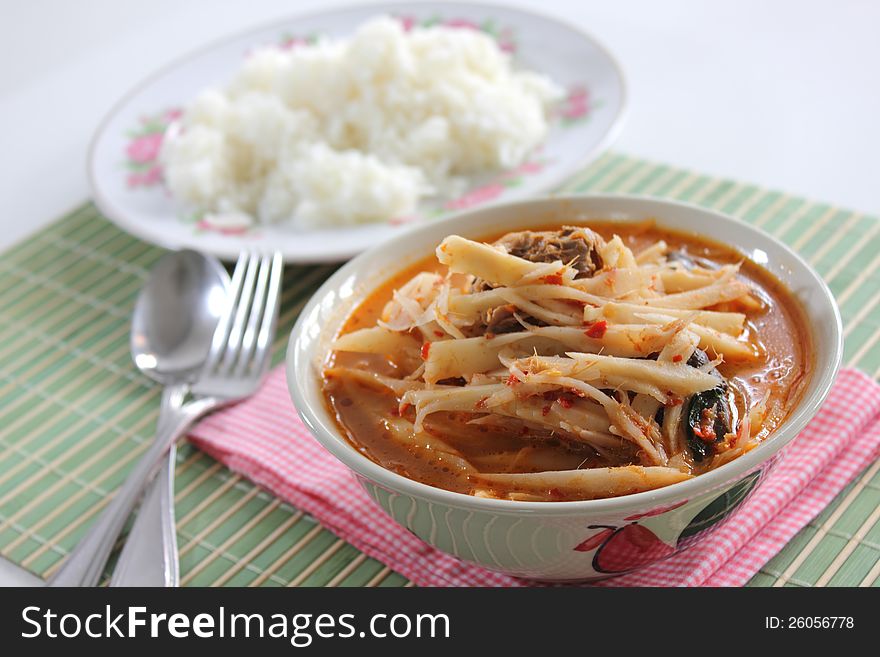 Curry Soft bamboo shoots with spoon fork