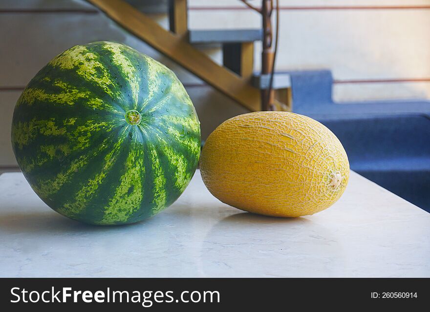 Melon and watermelon stand side by side