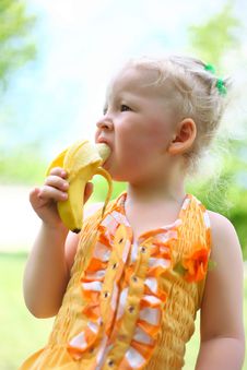 Portrait Of A Pretty Girl Eat A Banana Royalty Free Stock Photo