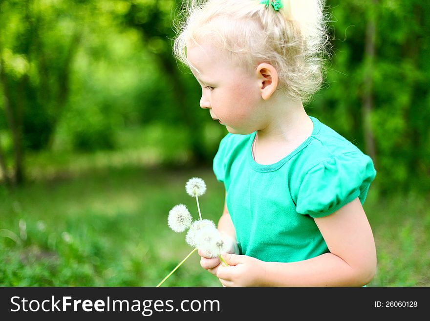 Portrait Of A Girl In The Park With Dandelions