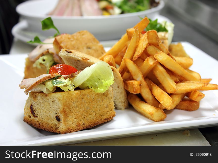 A open ham Sandwich and French fries