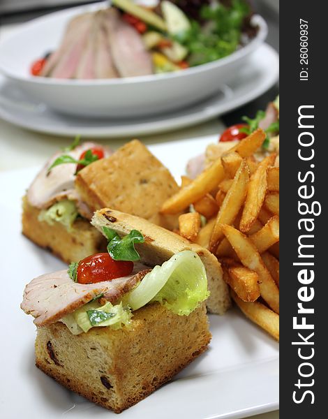 A open ham Sandwich and French fries