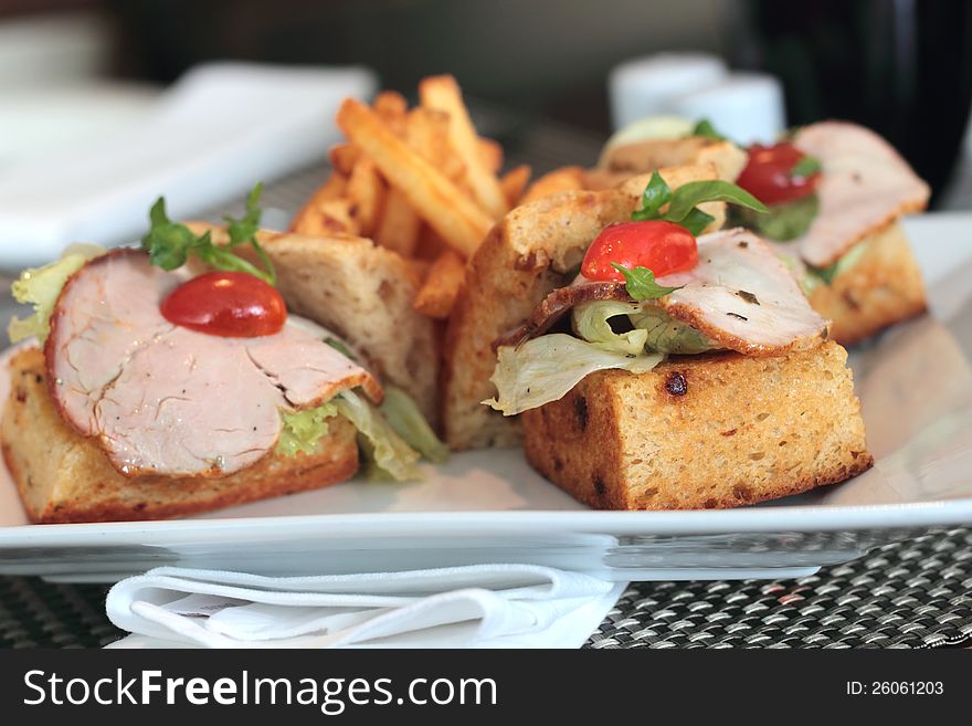 A open ham Sandwich with French fries