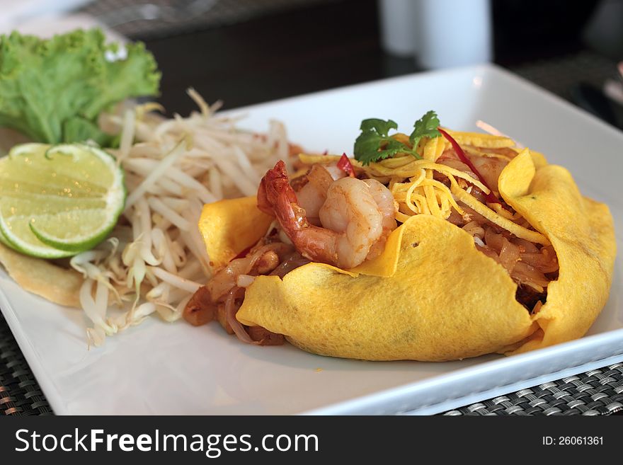 Thai stir-fried  shrimp wrapped in a egg sheet. Thai stir-fried  shrimp wrapped in a egg sheet.