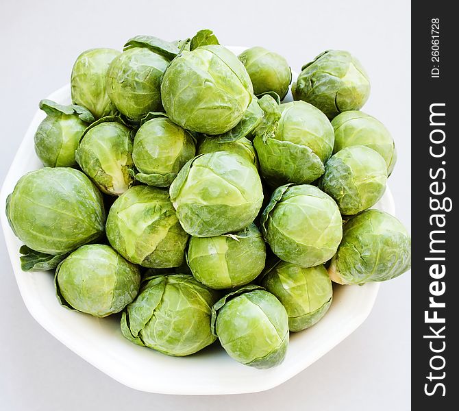 Fresh ripe brussels cabbage on gray background