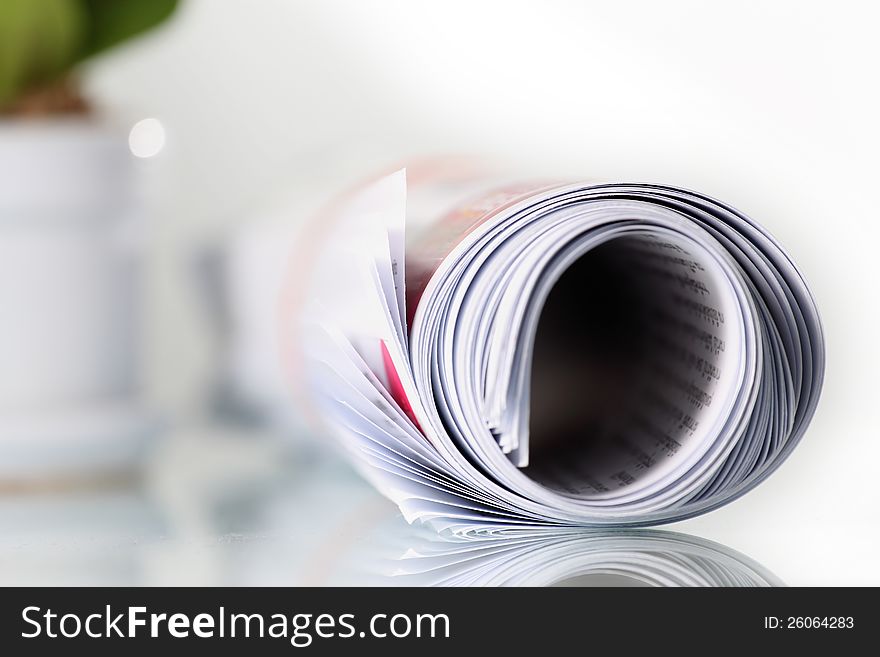 Roll of newspaper on the table