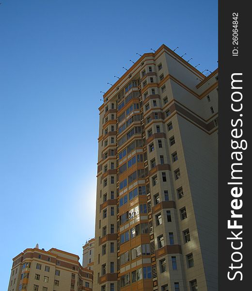 Russia, Moscow. High-rise residential building at sunset.