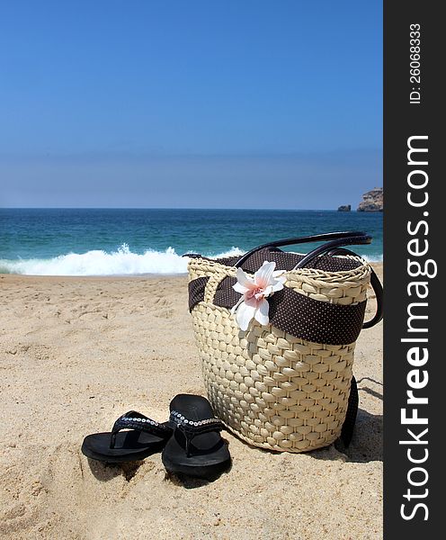 Seacoast, straw beach bag and flip-flops