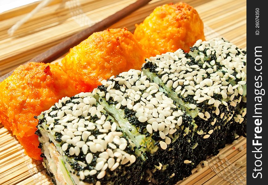 Rolls with black roe and sesame and baking sushi