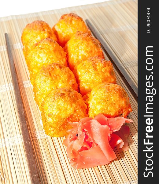 Hot sushi with roe and chopsticks inside. Hot sushi with roe and chopsticks inside