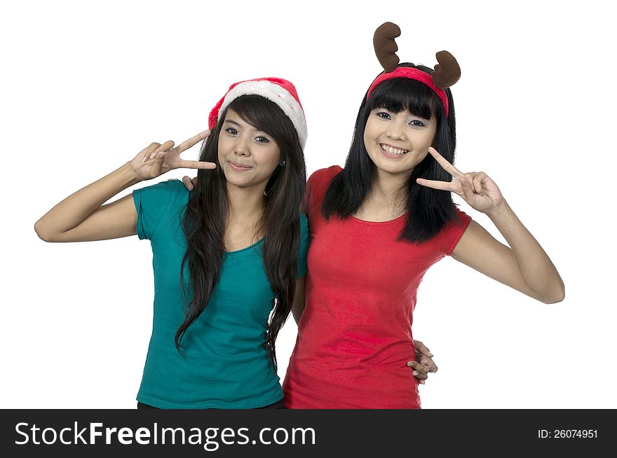 Two girls celebrate christmas isolated over white background. Two girls celebrate christmas isolated over white background