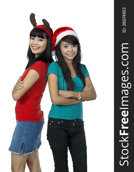 Two girls celebrate christmas isolated over white background. Two girls celebrate christmas isolated over white background