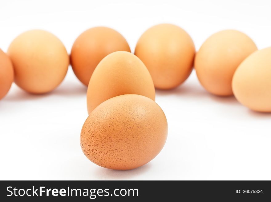 Brown eggs on a white background