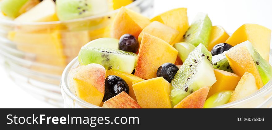 Close up photograph of a fresh salad of mixed fruits. Close up photograph of a fresh salad of mixed fruits
