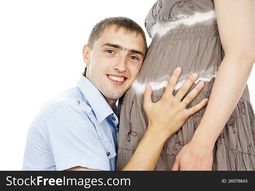 Husband a pregnant abdomen hugging. Husband a pregnant abdomen hugging