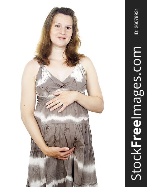 Happy pregnant woman stands isolated