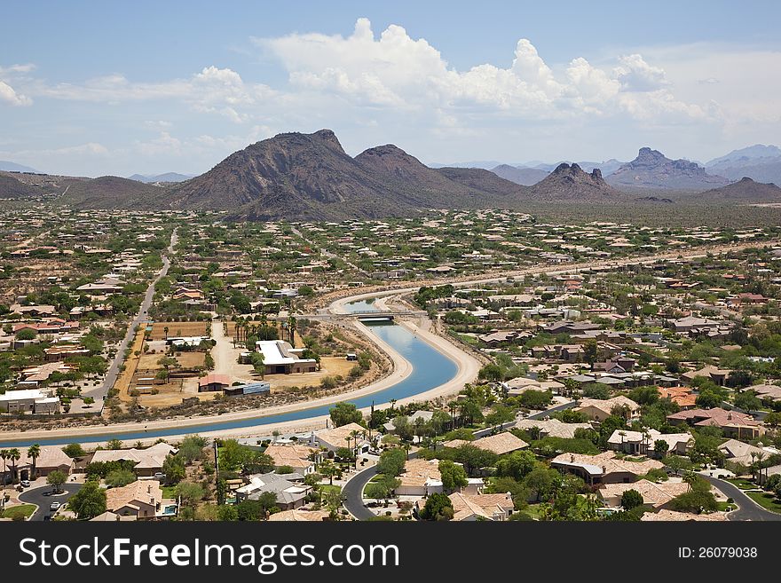 Aerial view of the Arizona Canal winding it's way through a Scottsdale, Arizona suburb