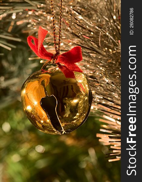 Jingle bells ornament hanging on the Christmas tree. Jingle bells ornament hanging on the Christmas tree