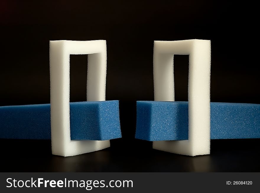 White and blue sponge on a black background