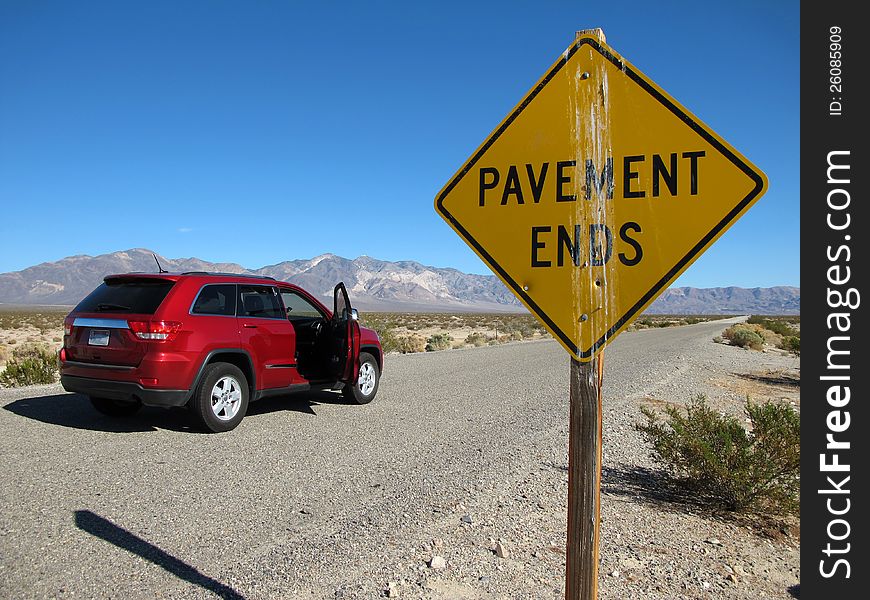 Pavement ends road sign through Death Valley