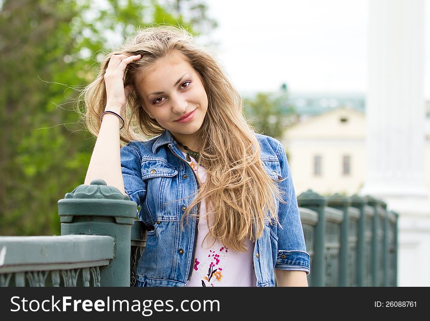 Beautiful girl standing on the bridge. Beautiful girl standing on the bridge