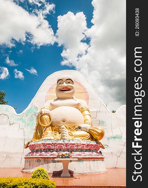 Happy buddha with blue sky background