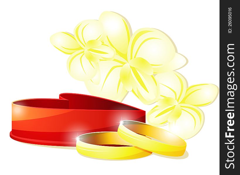 Two wedding rings and red box against pale yellow orchids. Two wedding rings and red box against pale yellow orchids