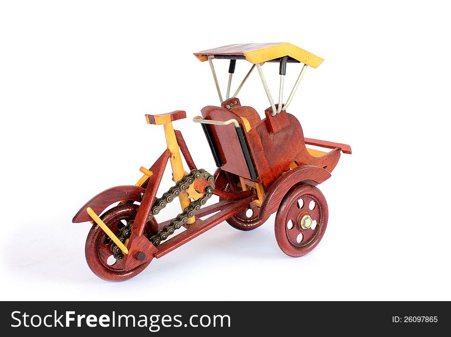 Wooden bicycle on white background