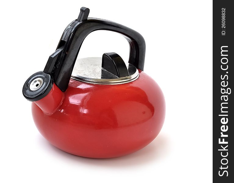 A red pitcher, used for heating water. A red pitcher, used for heating water