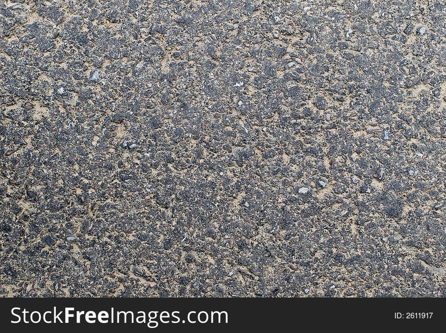 Sandy grey worn tarmac texture. Sandy grey worn tarmac texture