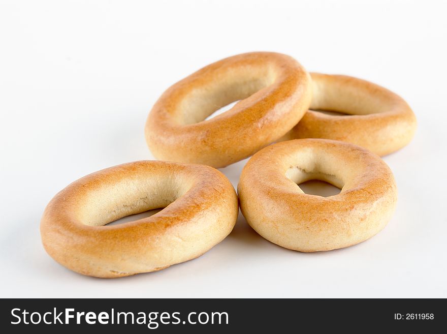 Heap of small bagels on white background