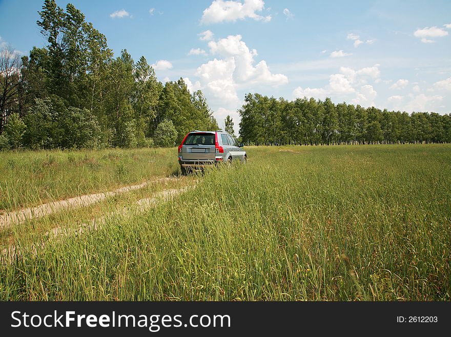 The modern car on earth road a sunny day