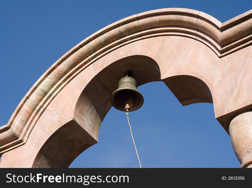 Church bell against clear blue sky