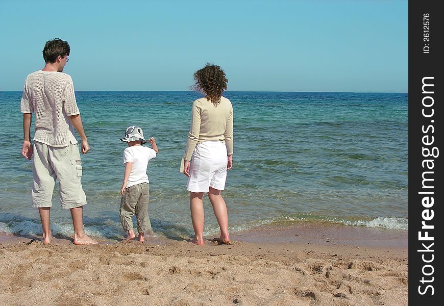 Family on a sand beach. Family on a sand beach