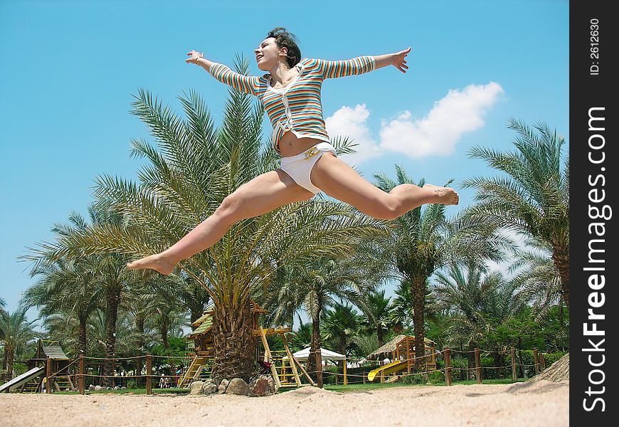 Girl  jumping on a beach